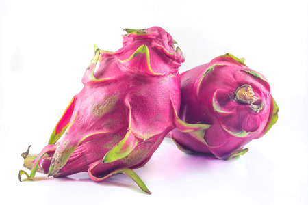 Fresh from the farm Two results Dragon fruit isolated against whiteの写真素材