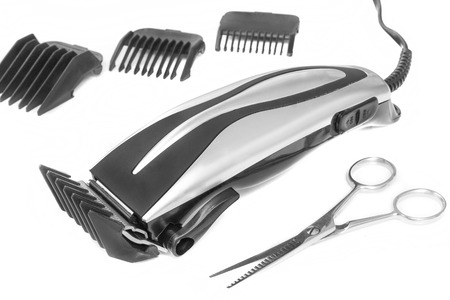 Beard and hair clippers and scissors on the white background.の写真素材