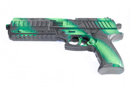 Handgun weapon toy on white background.の写真素材