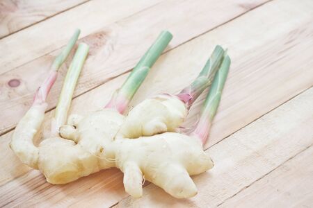 Ginger fresh on wood background.の写真素材