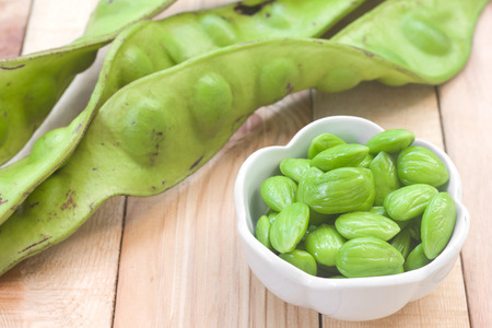 Sato seeds thailand vegetable and herb for thaifood on wood background.の写真素材