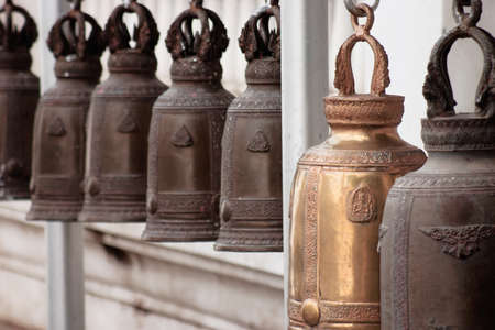 old brass church bells with thai temple