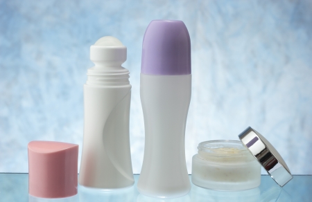 a group of  deodorants with cream on blue sky backgroundの写真素材