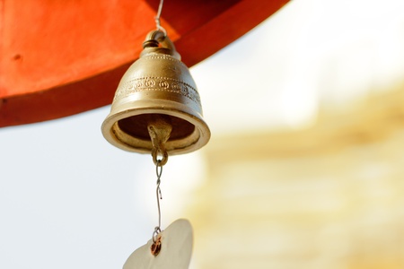 old brass Buddhist bell in  temple.の写真素材