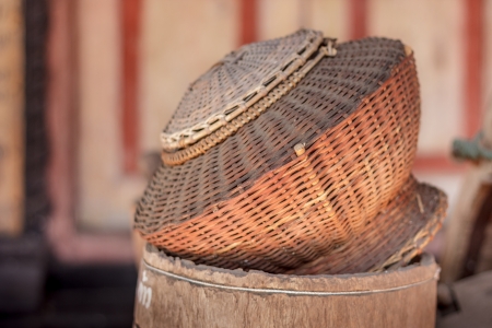 Old handmade wicker basket Surrounded in log home.の写真素材