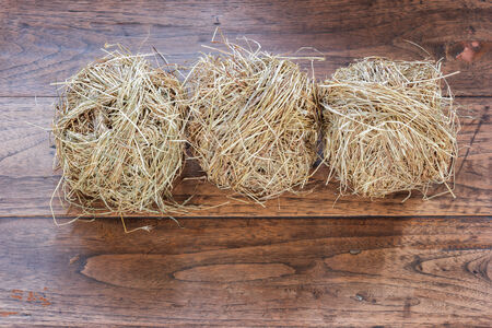 hay on grunge wooden background の写真素材