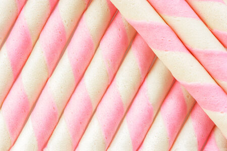 Closeup pink stripe wafer rolls Background  の写真素材