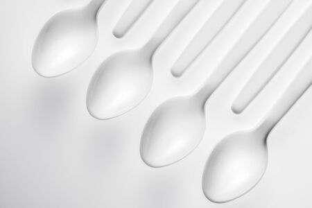 pattern of white spoon on white backgroundの写真素材