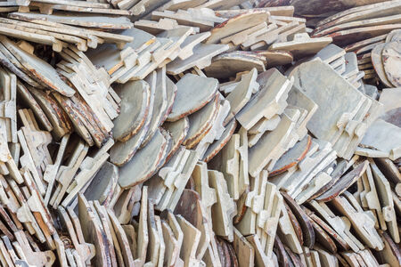 Closeup stack of old orange roof tile.の写真素材
