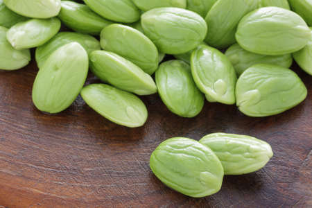 Pile of parkia on grunge wooden background.の写真素材