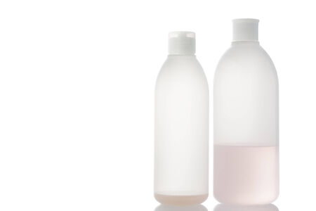 Old shampoo bottle isolated on white background.の写真素材