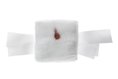 Gauze bandage with blood on white.の写真素材