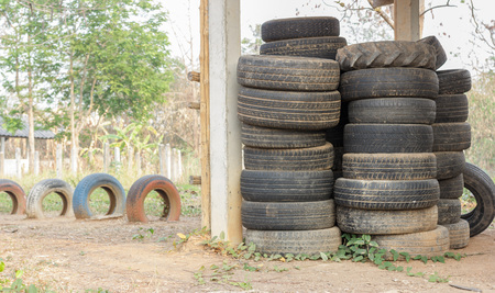 Stack  of old car tires for rubber recycling.のeditorial素材