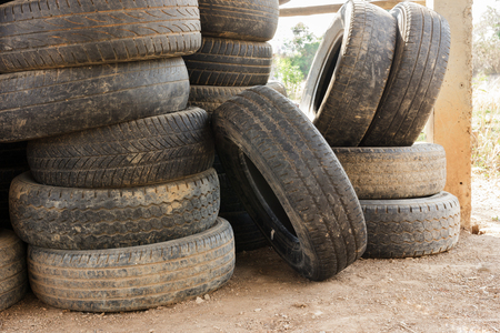 Stack  of old car tires for rubber recycling.のeditorial素材