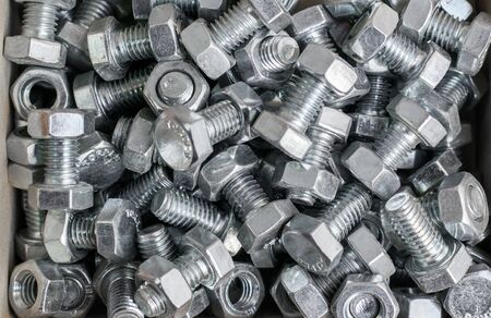 Hardware screws and nuts in a box