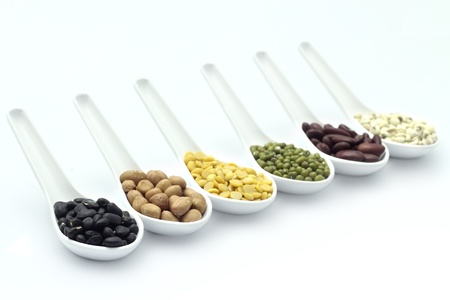 cereal in spoon on a white background.