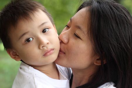 Mother and child outdoors in the parkの写真素材