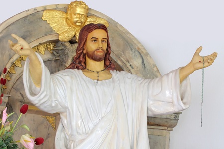 Jesus statue standing extended his armsの写真素材