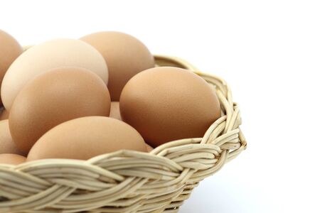Eggs in one basket on write blackの写真素材