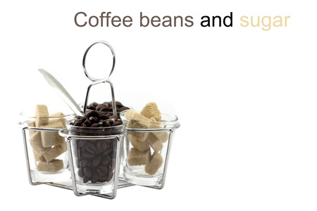 Coffee beans and sugar in glassの写真素材