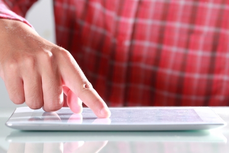 Man using digital tablet, Close-upの写真素材