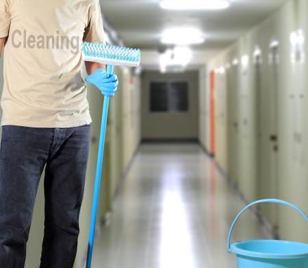 Cleaner Standing in the building for cleaningの写真素材