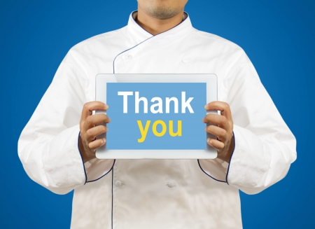 Chef showing a digital tablet with Text thank youの写真素材