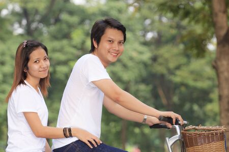 Young couple. Cycling in the parkの写真素材