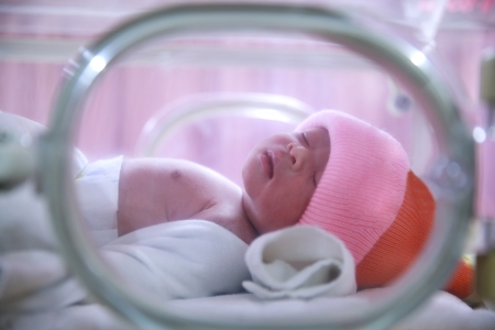 Newborn baby in hospital post-delivery room
