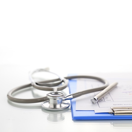 Stethoscope with blue medical clipboardの写真素材
