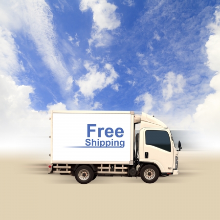 White van with Free Shipping and blue skyの写真素材