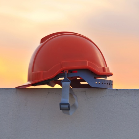 Construction helmet at sunsetの写真素材