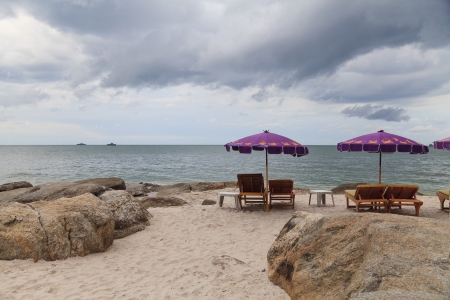 Beach chairs with umbrellaの写真素材