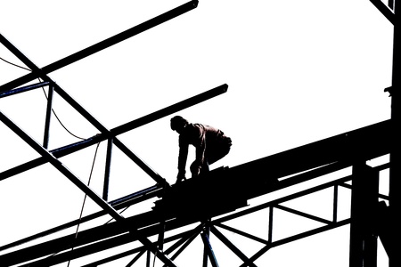 Silhouette of construction workers on white backgroundの写真素材