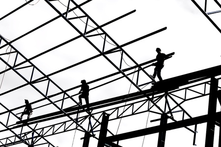 Silhouette of construction workers on white backgroundの写真素材