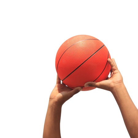 Hands and basketball on white backgroundの写真素材