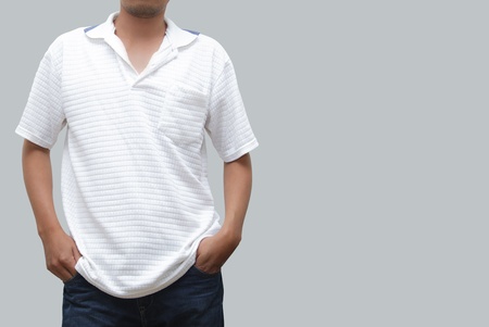 Man posing in jeans and polo shirtの写真素材