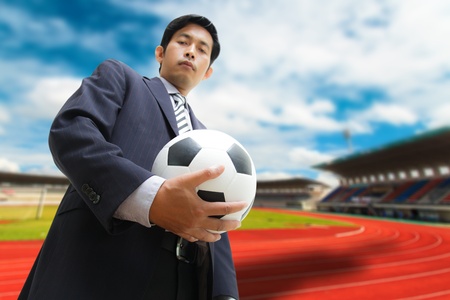Business man with soccer ballの写真素材