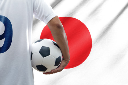 Soccer player with japan flagの写真素材