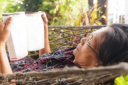 Asian seniors woman reading a bookの写真素材