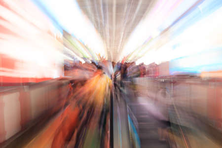 City people walking in sky train station in motion blur 