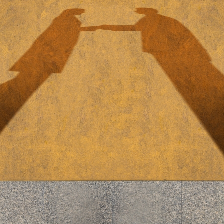 Shadow on the floor of business handshakeの写真素材