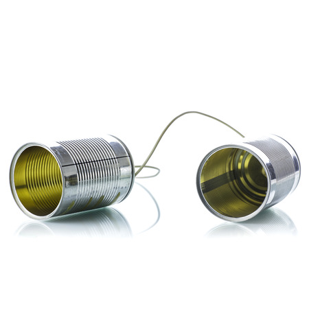 Tin cans telephone on white background