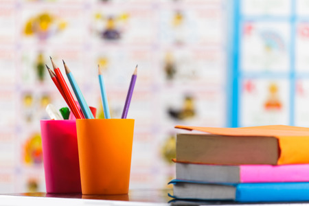 Pencils and book on table の写真素材