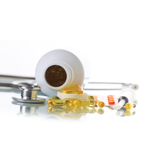 Stethoscope with syringe and medicineの写真素材