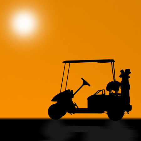 Silhouettes of golf cart on golf courseの写真素材