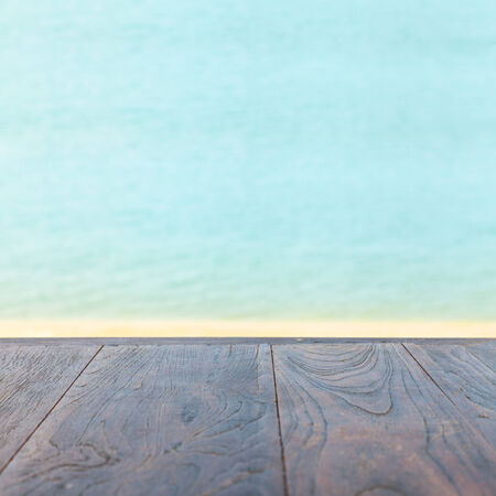 wooden table on the beach の写真素材
