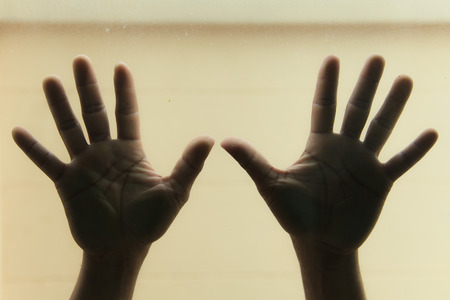 Hands on glassの写真素材