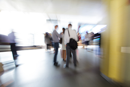 Business people walking in the city in motion blur