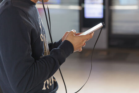 Man on smart phone, young man in the subway station